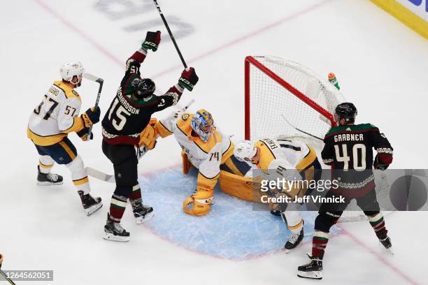 Brad Richardson of the Arizona Coyotes shoots the puck past Juuse Saros of the Nashville Predators for a game winning overtime goal at 5:27 in Game...
