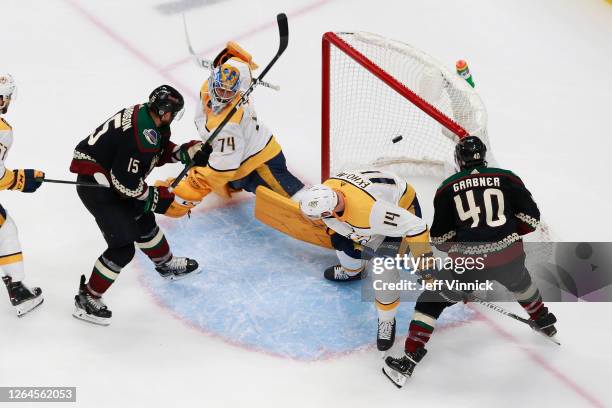 Brad Richardson of the Arizona Coyotes shoots the puck past Juuse Saros of the Nashville Predators for a game winning overtime goal at 5:27 in Game...