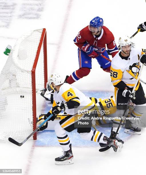 Artturi Lehkonen of the Montreal Canadiens celebrates his goal as Tristan Jarry,Justin Schultz and Kris Letang of the Pittsburgh Penguins look on in...
