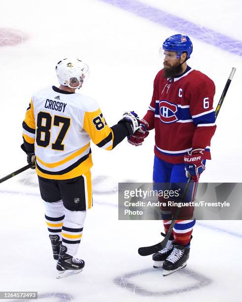 Sidney Crosby of the Pittsburgh Penguins congratulates Shea Weber of the Montreal Canadiens on the series win after Game Four of the Eastern...