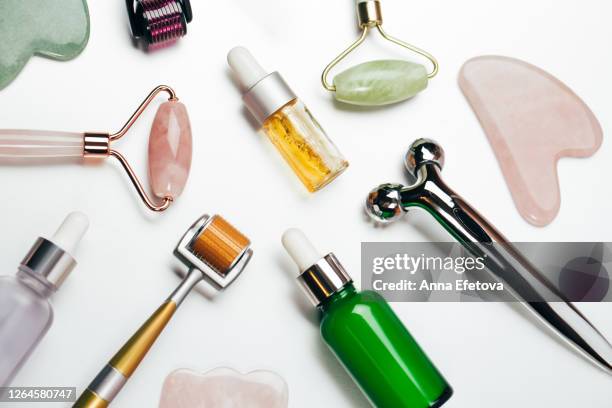 oils and tools for face massage - facial cleanse stock pictures, royalty-free photos & images