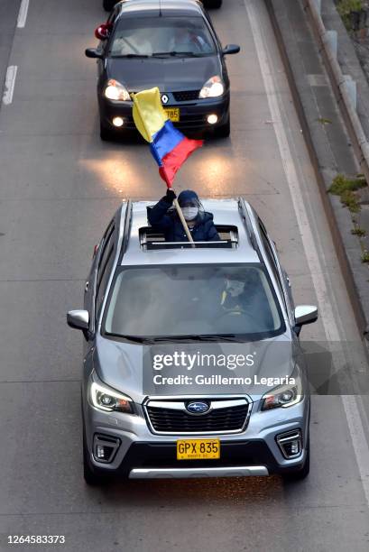 Supporters of former President Alvaro Uribe takes part in a caravan in favor of ex-president of Colombia Alvaro Uribe Velez on August 07, 2020 in...