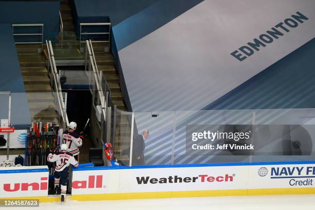 Josh Archibald and Oscar Klefbom of the Edmonton Oilers leave the ice following their teams 3-2 loss against the Chicago Blackhawks in Game Four of...