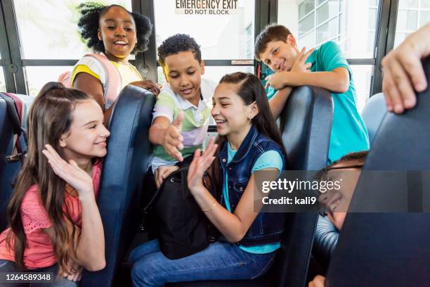 students riding school bus, boy with down syndrome - children only stock pictures, royalty-free photos & images