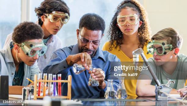 african-american man teaching high school chemistry lab - teenager awe stock pictures, royalty-free photos & images