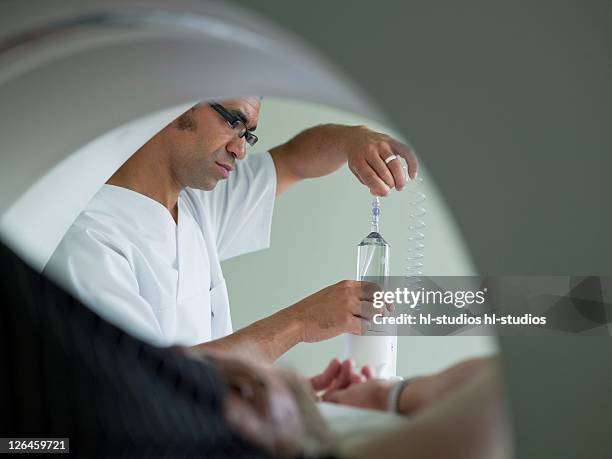 nurse adjusting x-ray machine - fluoroskop bildbanksfoton och bilder