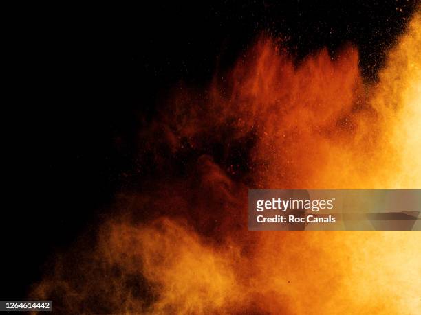powder explosion - yellow smoke stock pictures, royalty-free photos & images