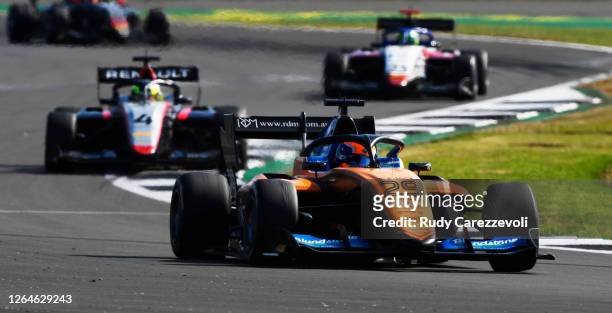 Alex Peroni of Australia and Campos Racing leads Max Fewtrell of Great Britain and Hitech Grand Prix during race one of the Formula 3 Championship at...