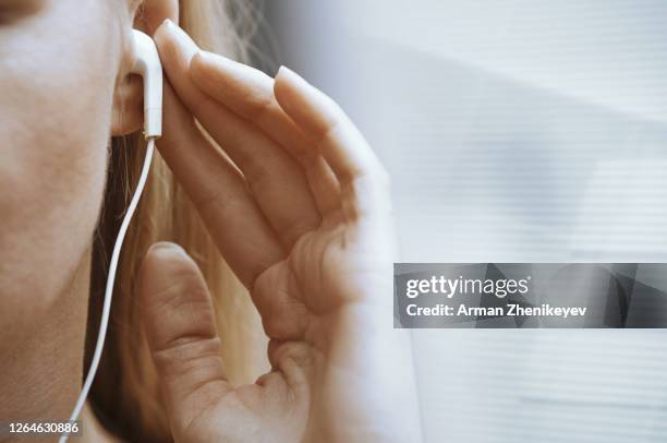 woman with in-ear headphones - walkman closeup stock pictures, royalty-free photos & images