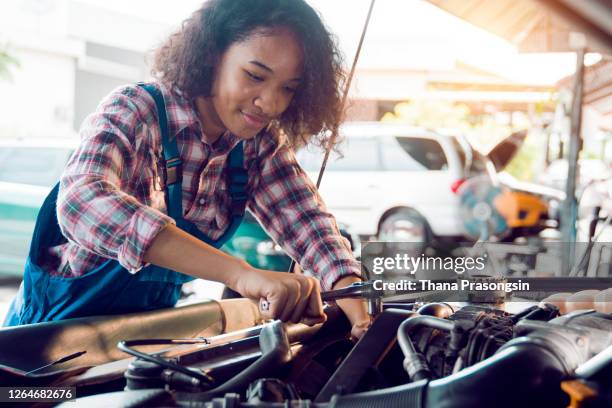 proud female auto mechanic - woman leaning stock pictures, royalty-free photos & images