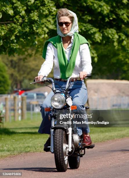 Penelope Knatchbull, Lady Brabourne seen riding a mini 'Easy-Rider' motorbike as she attends day 1 of the Royal Windsor Horse Show in Home Park on...