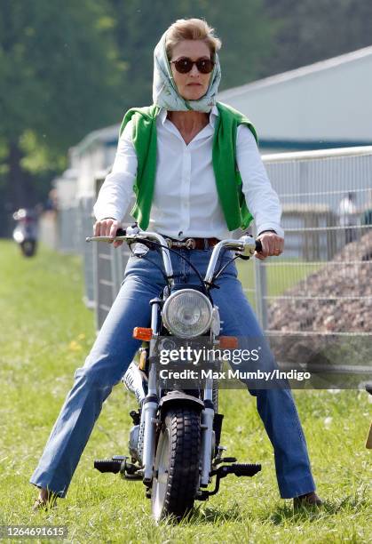 Penelope Knatchbull, Lady Brabourne seen riding a mini 'Easy-Rider' motorbike as she attends day 1 of the Royal Windsor Horse Show in Home Park on...