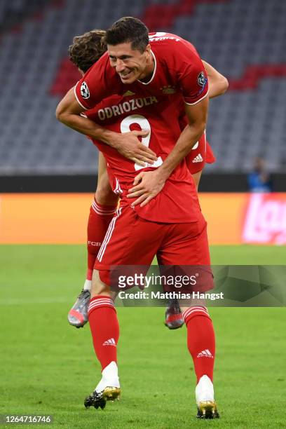 Robert Lewandowski of Bayern Munich celebrates with Alvaro Odriozola Arzallus of Bayern Munich after scoring his sides fourth goal during the UEFA...