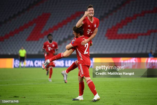 Robert Lewandowski of Bayern Munich celebrates with Alvaro Odriozola Arzallus of Bayern Munich after scoring his sides fourth goal during the UEFA...