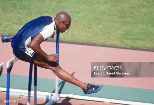 Allen Johnson of the USA competes in the Men's 110 Meters Hurdles event of the 1999 USA Track and Field Outdoor Championships at Hayward Field on the...