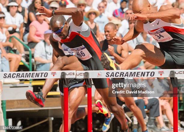 Allen Johnson of the USA competes in a qualifying round of the Men's 110 meters Hurdles event of the 2000 USA Track and Field Olympic Trials on July...