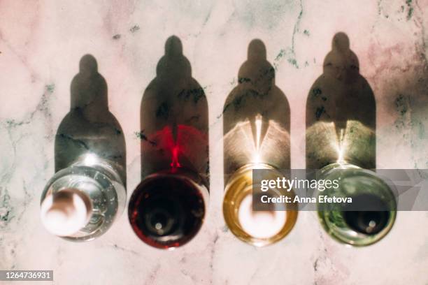 row of bottles with lotions - skin care ingredients stock pictures, royalty-free photos & images