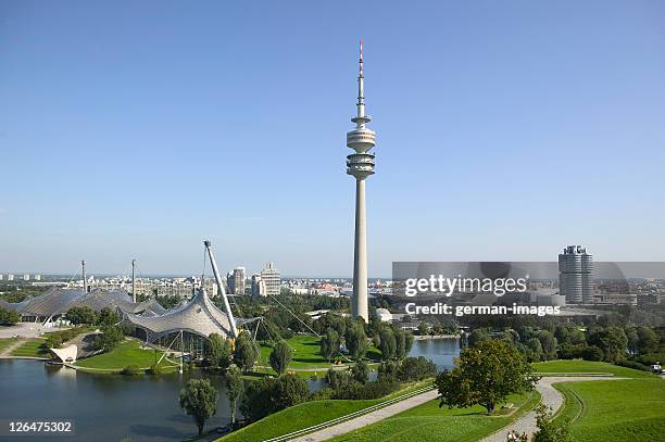 communication tower in city - olympiapark stock pictures, royalty-free photos & images