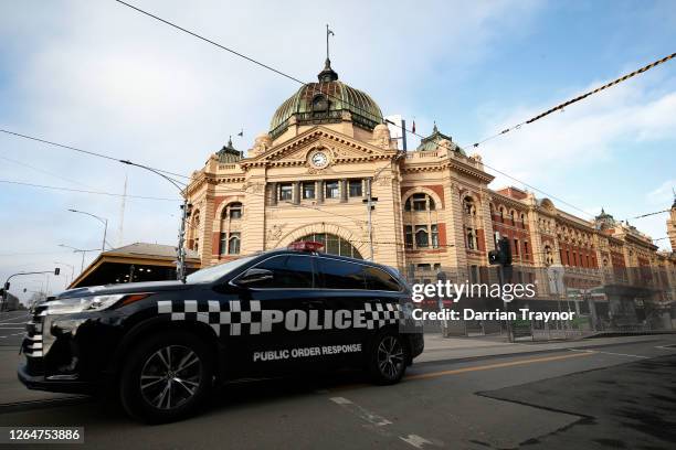 Police patrol in the city on August 09, 2020 in Melbourne, Australia. Protesters face fines and arrest for breaching the Chief Health Officer's...
