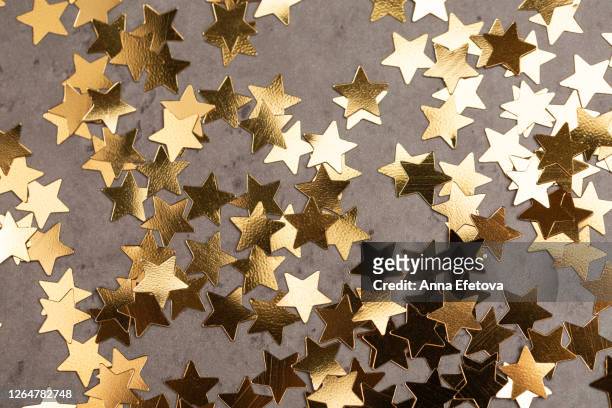 star shaped confetti on table - congratulations stock pictures, royalty-free photos & images