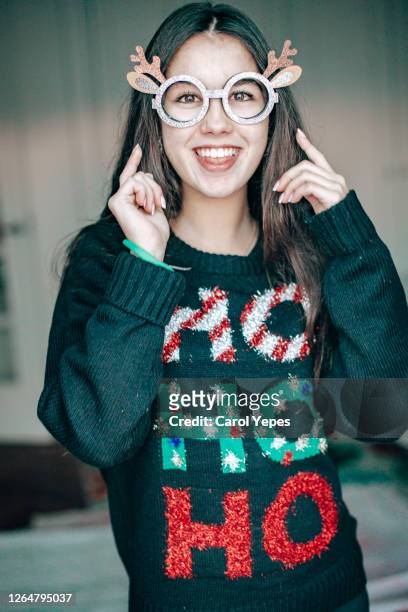 beautiful teenager in xmas sweater and   funny glasses - ugly people stock pictures, royalty-free photos & images