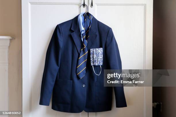 school uniform and face mask for use during covid 19 coronavirus pandemic - school uniform 個照片及圖片檔