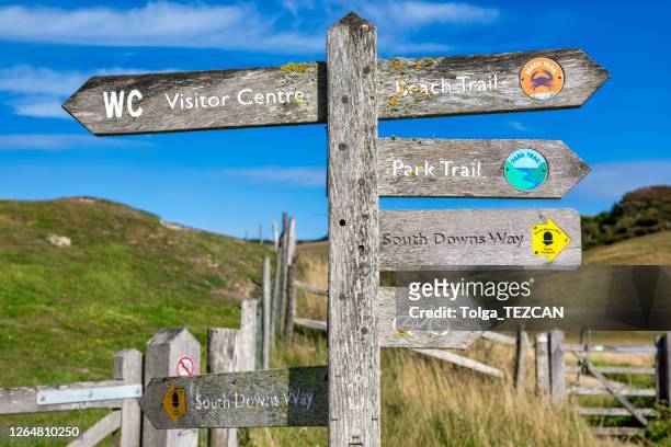 coastal signpost. seven sisters, uk - seven sisters cliffs stock pictures, royalty-free photos & images