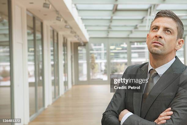 business man looking up - man with gray hair stock pictures, royalty-free photos & images