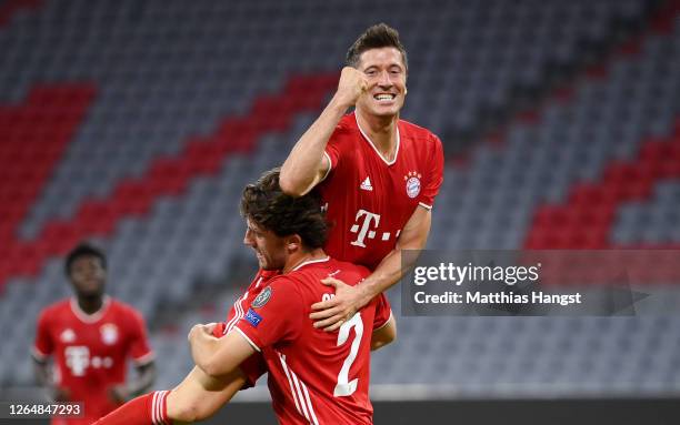 Robert Lewandowski of Bayern Munich celebrates with Alvaro Odriozola Arzallus of Bayern Munich after scoring his sides fourth goal during the UEFA...