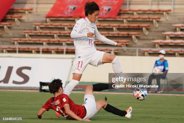 Kana Osafune of Urawa Red Diamonds and Saori Takarada of Cerezo Osaka Sakai Ladies compete for the ball during the Nadeshiko League match between...