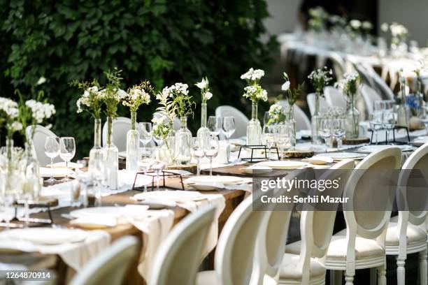 table decorations in white on rustic wedding - stock photo - wedding table setting stock-fotos und bilder