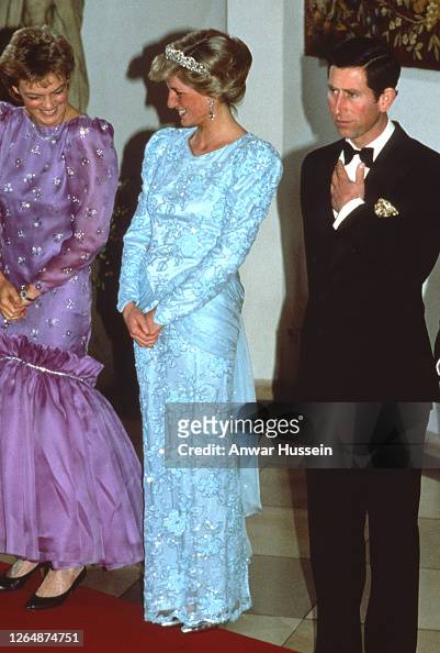 Diana, Princess of Wales , wearing a blue chiffon and lace dress with ...