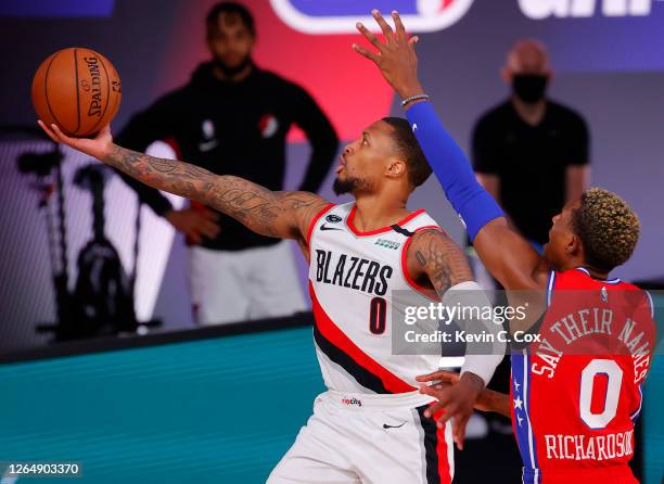 Damian Lillard of the Portland Trail Blazers goes up for a shot against Josh Richardson of the Philadelphia 76ers at Visa Athletic Center at ESPN...