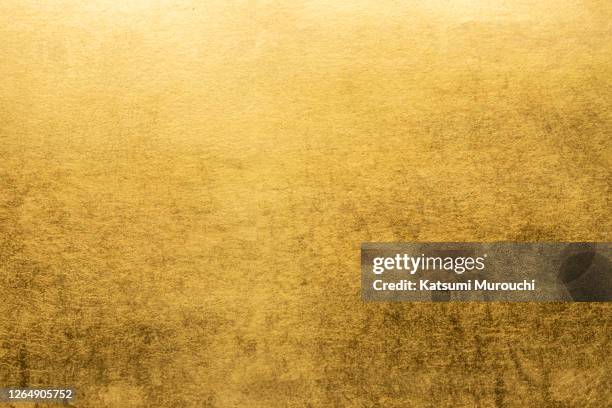 gold leaf texture background - gold foil stock-fotos und bilder