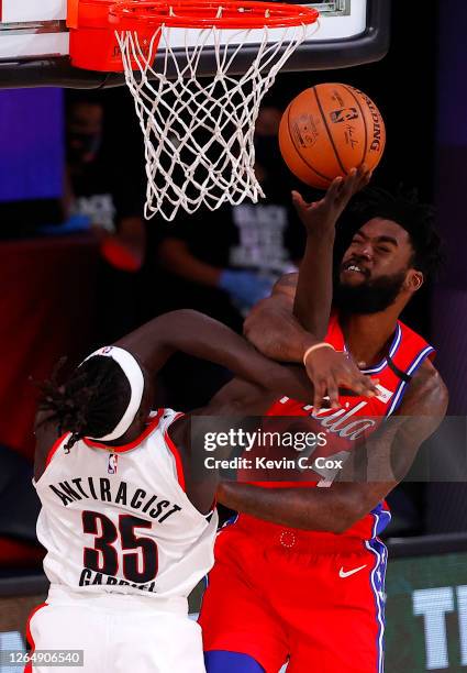 Norvel Pelle of the Philadelphia 76ers blocks as shot by Wenyen Gabriel of the Portland Trail Blazers at Visa Athletic Center at ESPN Wide World Of...