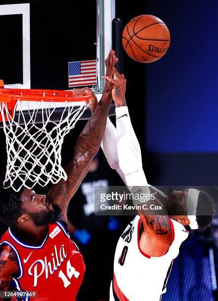 Norvel Pelle of the Philadelphia 76ers blocks a shot by Carmelo Anthony of the Portland Trail Blazers at Visa Athletic Center at ESPN Wide World Of...