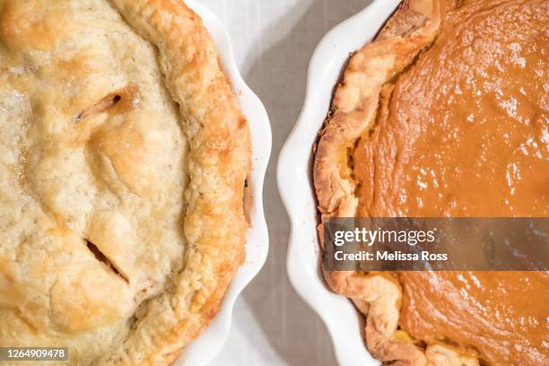 close-up of an apple pie and a pumpkin pie - baking competition stock pictures, royalty-free photos & images