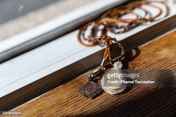 close up of buddha amulets - pendants stock pictures, royalty-free photos & images