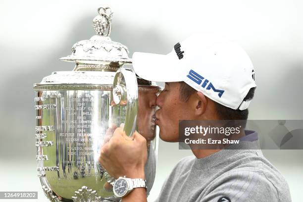 Collin Morikawa of the United States celebrate by kissing the Wanamaker Trophy after winning during the final round of the 2020 PGA Championship at...