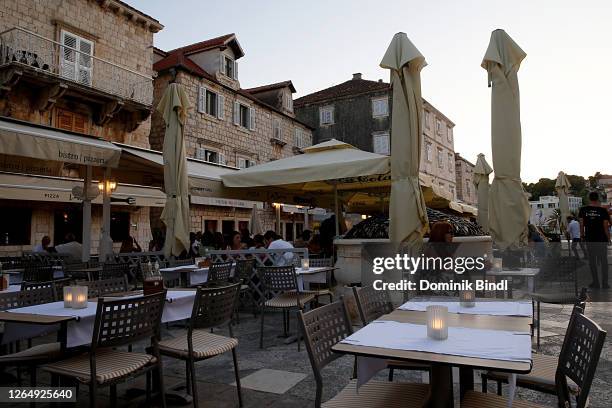 An empty restaurant seen from the main square on July 21, 2020 in Hvar, Croatia. Hvar is a city and port on the island of Hvar, part of...