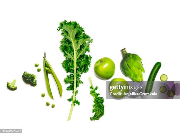 fresh green vegetables and fruits - broccoli on white stockfoto's en -beelden