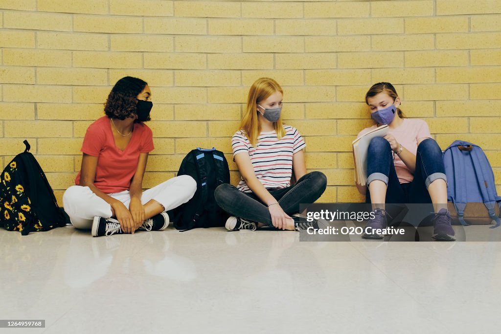 High School Students In School Wearing Protective Face Mask
