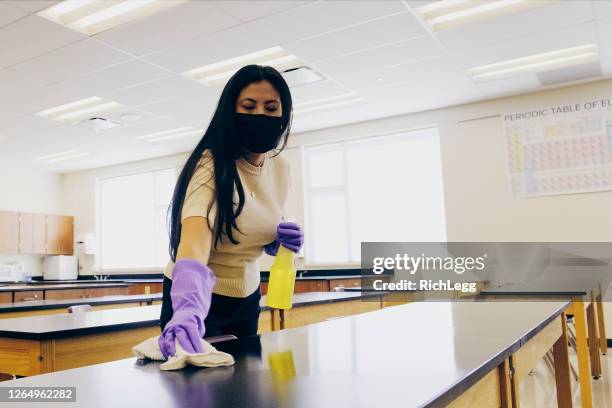 school teachers cleaning a classroom - disinfection school stock pictures, royalty-free photos & images