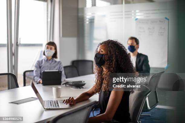 business people having meeting during pandemic - occupation stock pictures, royalty-free photos & images