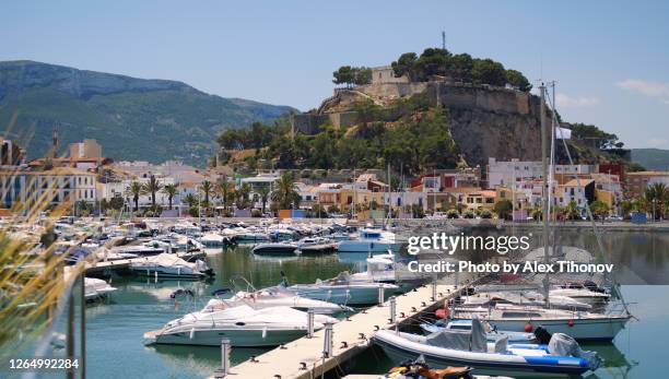 denia castle and harbour. spain - denia stock pictures, royalty-free photos & images