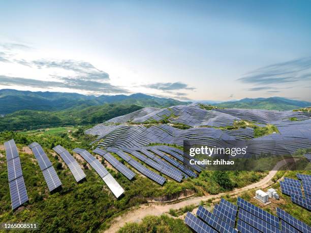 a drone view of the spectacular solar power station on the top of the mountain - shifting cultivation stock pictures, royalty-free photos & images