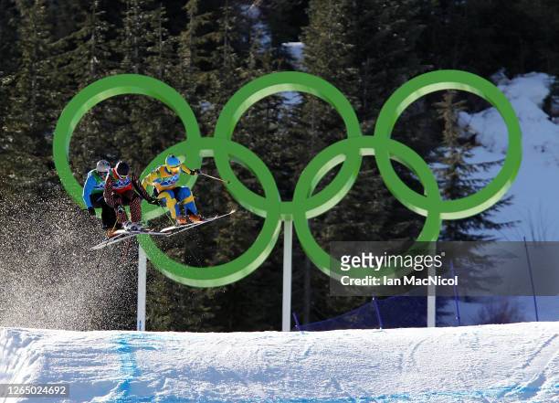 Filip Flisar of Slovenia, Christopher Delbosco of Canada and Tommy Eliasson of Sweden compete in a men's ski cross race on day ten of the Vancouver...