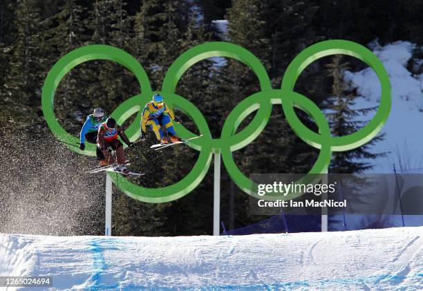 Filip Flisar of Slovenia, Christopher Delbosco of Canada and Tommy Eliasson of Sweden compete in a men's ski cross race on day ten of the Vancouver...