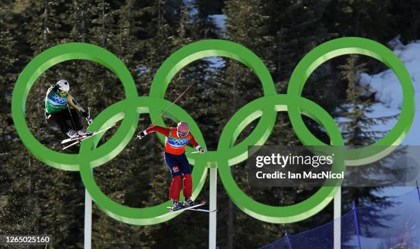 Scott Kneller of Australia and Audun Groenvold of Norway compete in a men's ski cross race on day ten of the Vancouver 2010 Winter Olympics at...