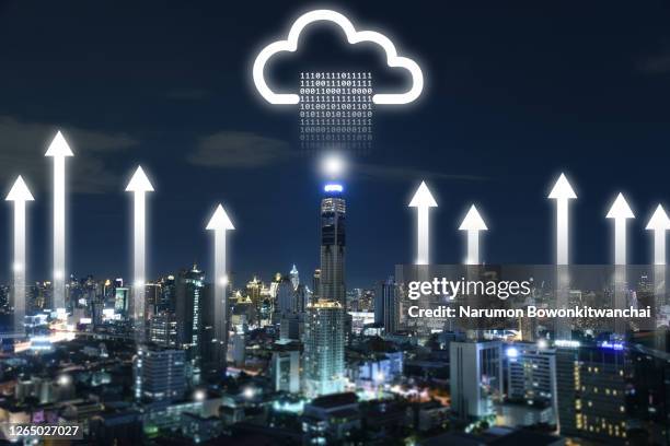 the cityscape image overlay with the binary data rises up to the cloud hologram - data collection stock-fotos und bilder